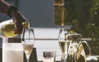 Wine being pour into glass in a restaurant setting
